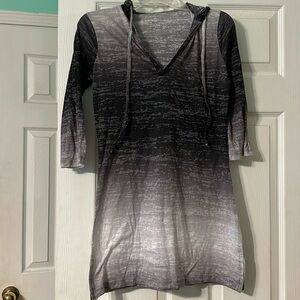 Three quarter sleeve shirt with hood.